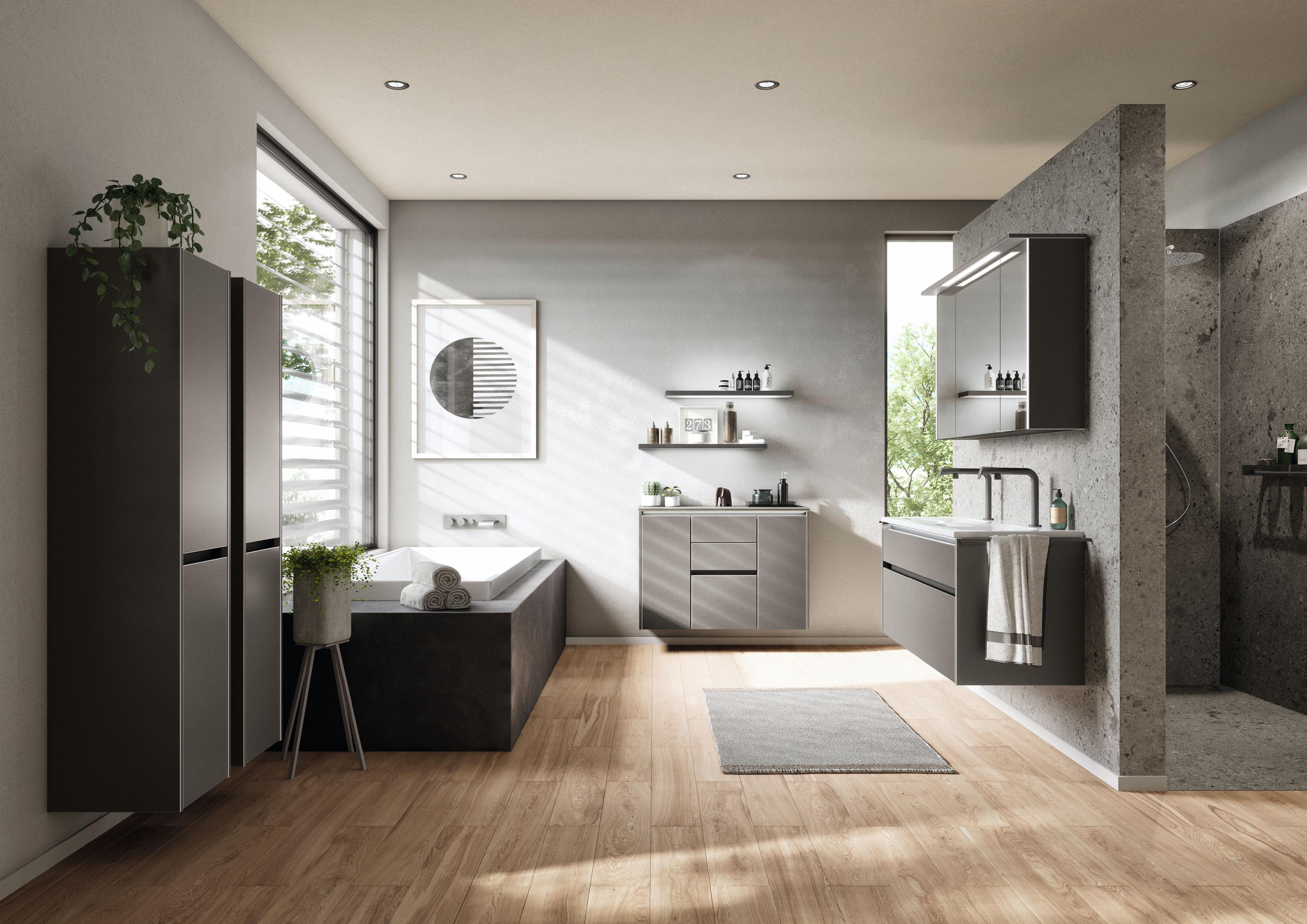 Modernes Badezimmer mit grauen Badmöbeln, freistehender Badewanne, bodentiefer Dusche und minimalistischer Einrichtung.